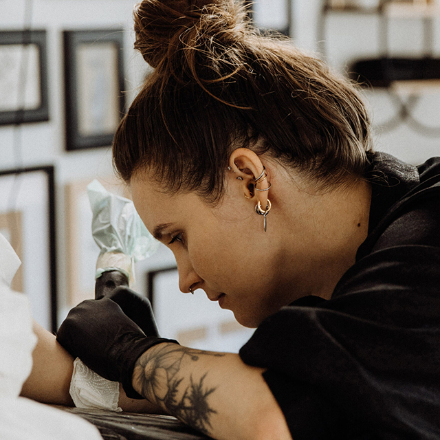 female fineline tattoo artist working in salzburg austria