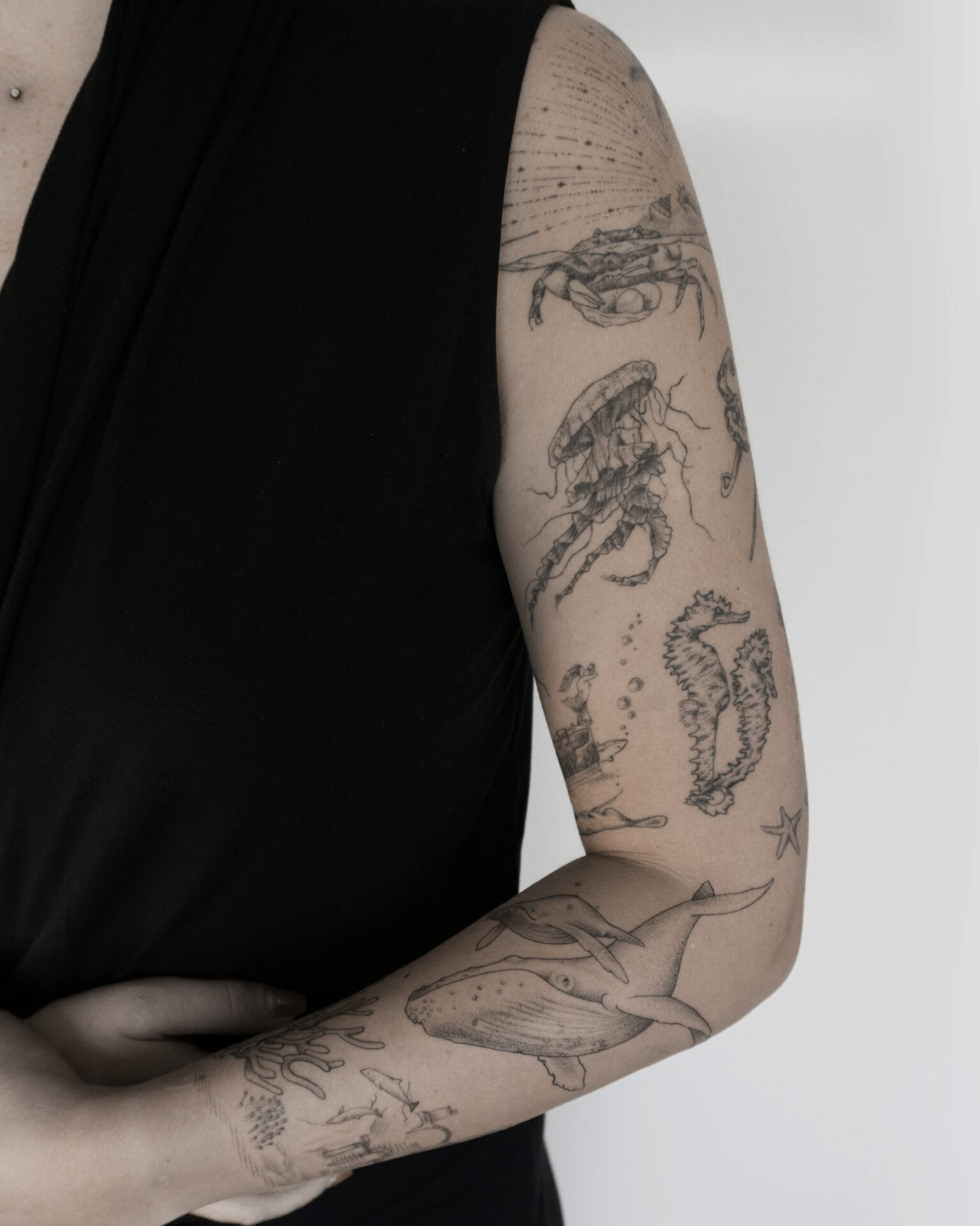 fineline sea sleeve tattoo with whale jellyfish fish shark statue and a lot more from smasli ink an female tattoo artist working in salzburg austria